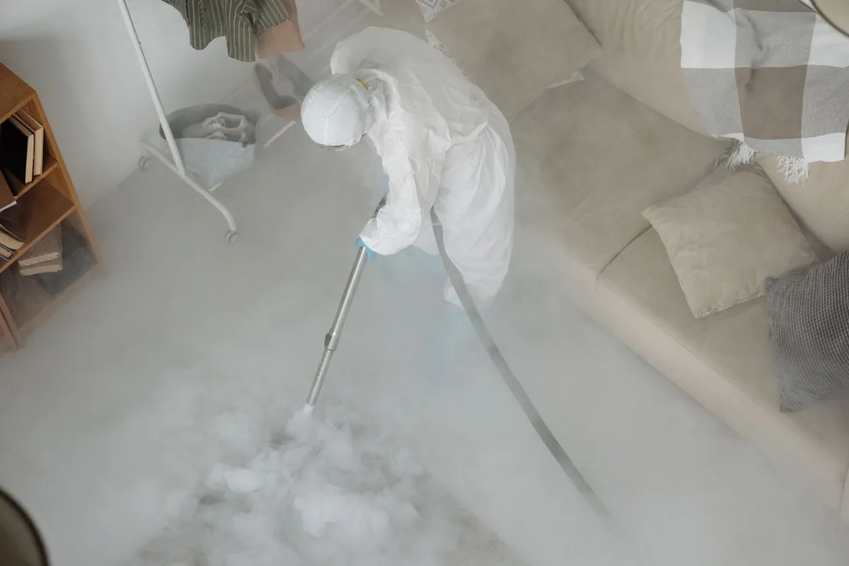 Biohazard cleanup technician in protective equipment, Higginson, AR